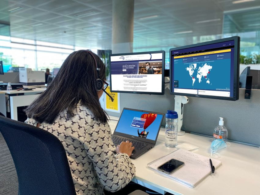 london-assistance-cenre-female-employee-checking-marnager-view